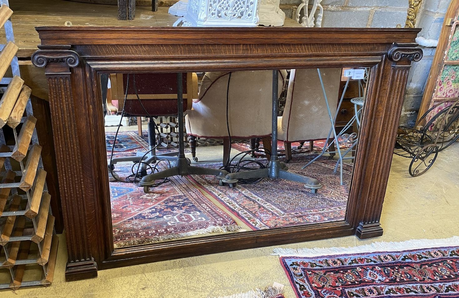 A late Victorian oak ionic column overmantel mirror, width 126cm, height 82cm